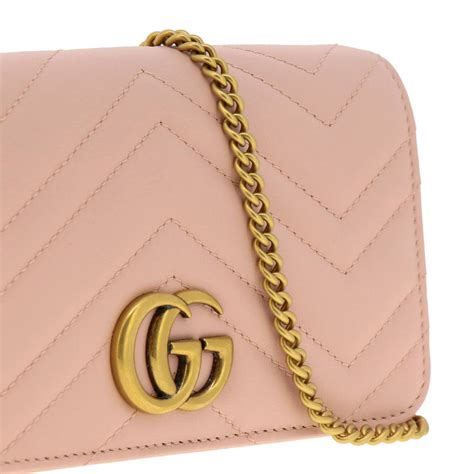 Mini borsa effetto gomma con GG in pelle fucsia 